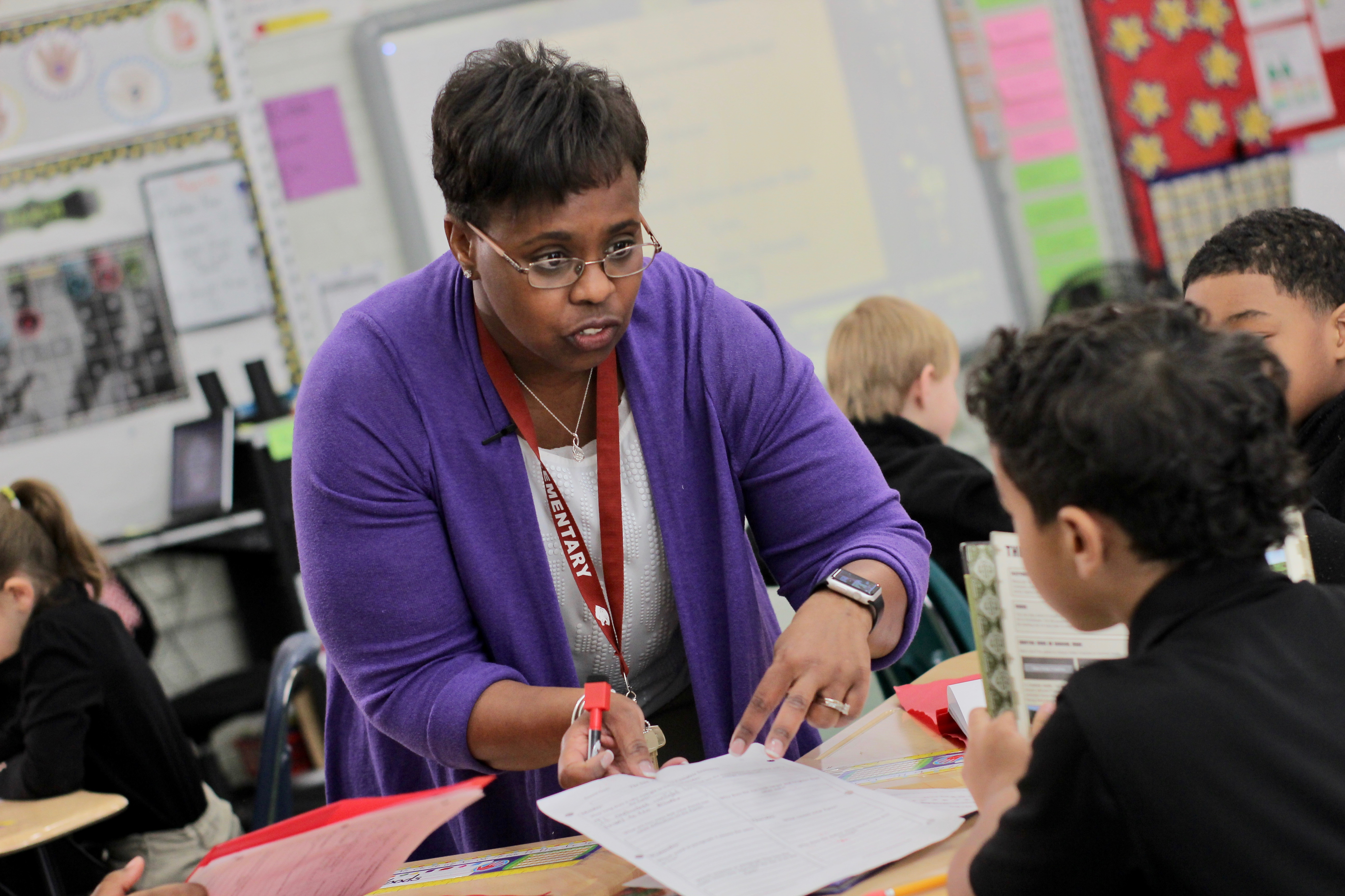 Teacher Karen Edwards works with a student. Teacher Karen Edwards works with a student.